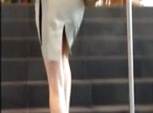 Sexy gal flashed upskirt on the stairs