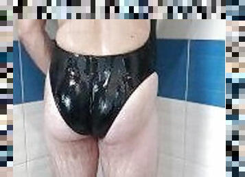 Boy wearing sexy realise Black swimsuit and get shower