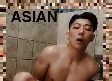 Horny Asian college jock plays with dildo in risky public shower