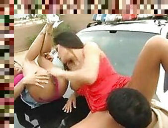 Threesome on the hood of a police car