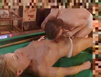 Young lesbians on the pool table hooking up
