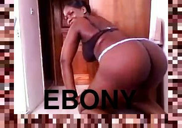 Charming ebony girl shows her juicy butt for the webcam