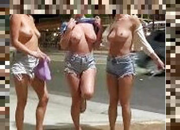Flashing on a busy street with friends