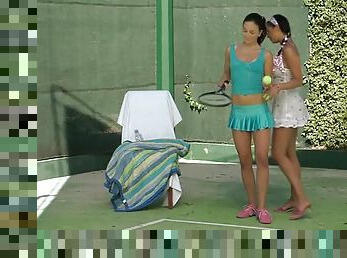 Two brunette lesbians fingering each other on the tennis court