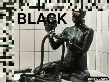 Rubber girl full in black latex catsuit has fun with her toys and tries some breath play games