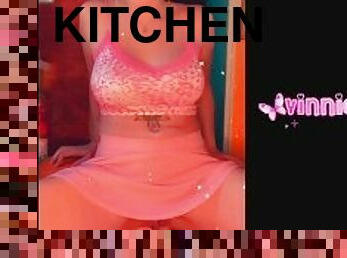 Teen in pink skirt pisses on the kitchen floor