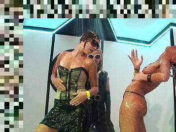Drunk girls get naked, kiss and get wet at a nightclub
