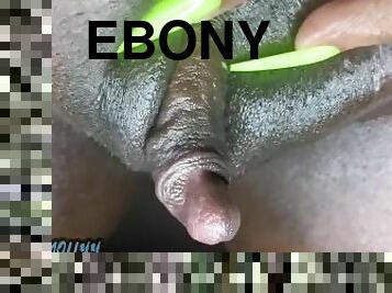 Showing her huge ebony clit