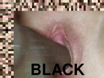 Squirting on a black dildo 