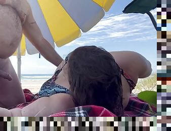 Fukbunnies on a public beach with a voyeur watching and jerking off