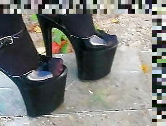 Lady L walking xtreme high heels glas road.(video short ver)