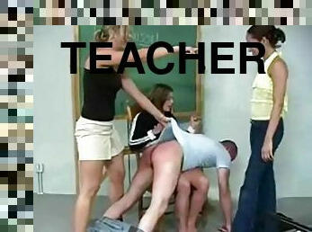 Horny female teacher spanks a guy in front of two chicks