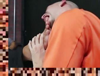 Uniformed prison guard foot worshipped by bald gay inmate
