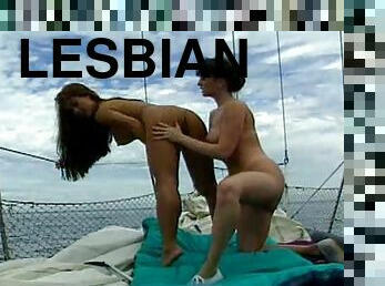 Curvy lesbians have sex on a boat