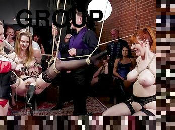 Suspended slave is pounded at bdsm party