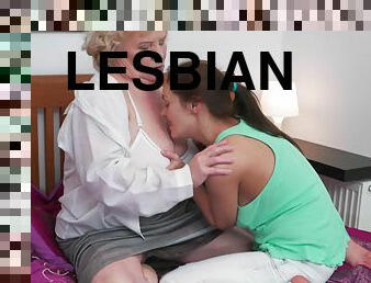 Lesbian Emra massages Lana C. feet and shaved pussy sensually