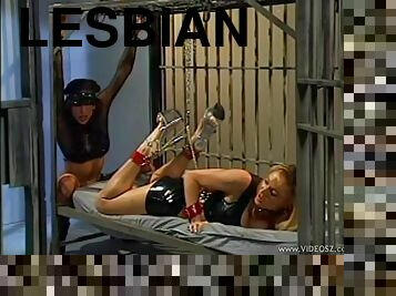 Lesbians wearing high heels fetish and spank in femdom prison scene
