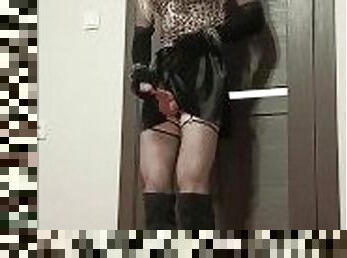 Crossdresser in velvet skirt leopard top and gloves hanging breathplay