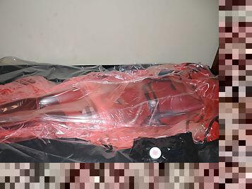 Mar 2 2023 - VacPacked in my long red raincoat under my PVC aprons and pink PVC sack