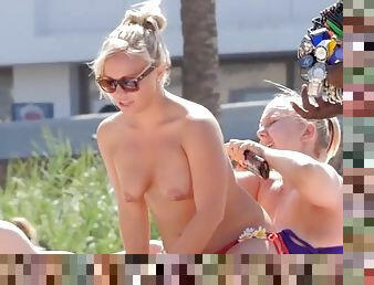 Topless blonde hottie spied on at the beach