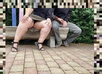 Mother-in-law jerks son-in-law's cock in a public park