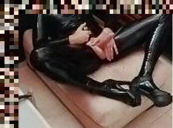 Latex sissy doll with sexy heels and feet having fun on an afternoon