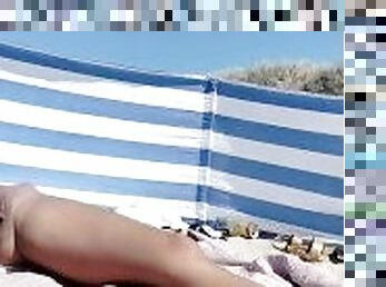 Spying my pussy on the beach, sunbathing